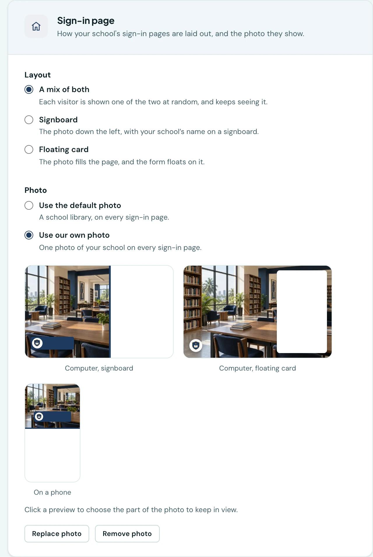 The Sign-in page section of Settings. Under Layout, three choices: A mix of both, selected, then Signboard and Floating card, each with a line saying what it looks like. Under Photo, Use the default photo and Use our own photo, selected. Below are three previews of the school's own library photo: a computer in the signboard layout, a computer in the floating card layout, and a phone. A line saying to click a preview to choose the part of the photo to keep in view, then Replace photo and Remove photo buttons, follow.