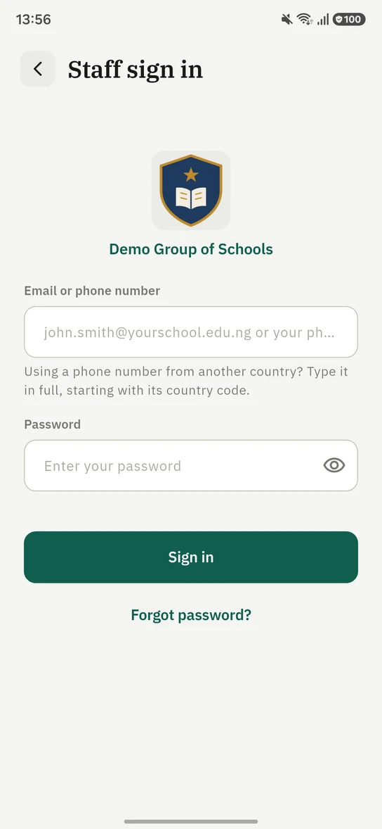 The 1410SMS Android app Staff sign in screen for Demo Group of Schools, showing the school crest and name, a single field labelled Email or phone number with the placeholder john.smith@yourschool.edu.ng or your phone number, a hint reading Using a phone number from another country? Type it in full, starting with its country code, a password field, a Sign in button and a Forgot password link.